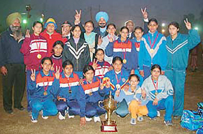 The Punjab womens kho-kho team poses with the trophy after winning the 38th Senior National Kho-Kho Championship 