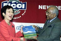 FICCI president A.C. Muthiah presenting a book 'India and Japan' to Japanese foreign minister Yoriko Kawaguchi