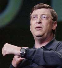 Microsoft chairman Bill Gates shows a Smart Personal Object Technology watch