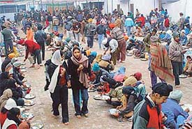 Devotees partake of langar in a gurdwara on the occasion of Guru Gobind Singhs birth anniversary