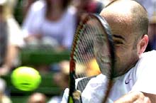 US tennis star Andre Agassi plays a return during his match against Richard Gasquet of France