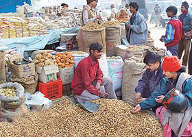 Groundnut and revri vendors have a field day as city residents flock the Sector 26 grain market for Lohri purchases in Chandigarh on Sunday.