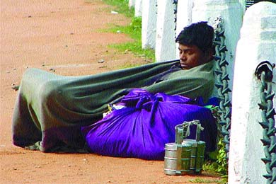 A daily wager enjoys a snooze at Rajpath 