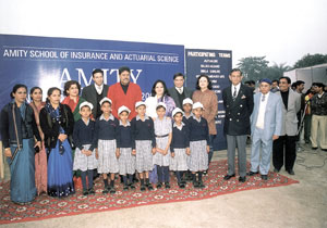Kapil Dev with destitute girl children at the prize distribution function
