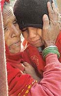 A relative comforts son of the murdered watchman