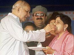 Bahujan Samaj Party chief Kanshi Ram offers a piece of cake to Uttar Pradesh Chief Minister Mayawati 