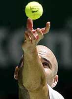Andre Agassi of the USA serves during his second-round match