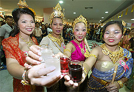 Contestants pose during a drinking competition for women