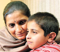 Six-year-old St Columbas student Shivam Arora with his mother.
