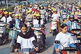 Students participate in the Save Oil Two-Weeler Womens Rally-2003 that was flagged off from Panjab University