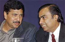 Union Minister for Telecommunication and Information Technology Pramod Mahajan (right) speaks with Chairman and Managing Director of Reliance Industries Mukesh D. Ambani during the inauguration of the Supercomm 2003 exhibition at Pragati Maidan in New Delhi 