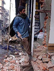 A shopkeeper gets his shop repaired