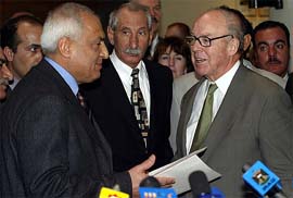 Iraqi President Saddam Husseins top adviser Amir al-Saddi stands next to U.N. Chief Inspector Hans Blix after ending talks in Baghdad