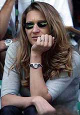 Former tennis superstar Steffi Graf watches her husband USAs Andre Agassi during his match against Sebastien Grosjean