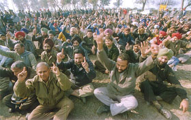 The employees of the NFL plant raise slogans during a dharna
