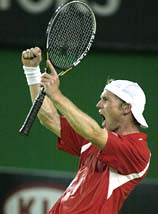 Rainer Schuettler of Germany celebrates his win over Andy Roddick