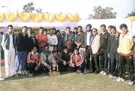 Cine star Raj Babbar and Kirti Azad with the Malviya Club team, which annexed the Sahibzada Ajit Singh Cricket Tournament