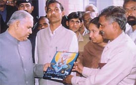 A portrait of Sant Durbal Nath being presented to Haryana Governor Babu Parmanand