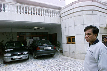 Vijay Sethia, a relative of Kalpana Chawla, stands outside her family home in Karnal.