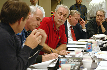 NASA Administrator Sean O'Keefe (C) and Bill Readdy (2nd-L), Associate Administrator for Space Flight and former astronaut, take part in their first formal briefing at the agency's Situation Room at NASA Headquarters in Washington on Sunday