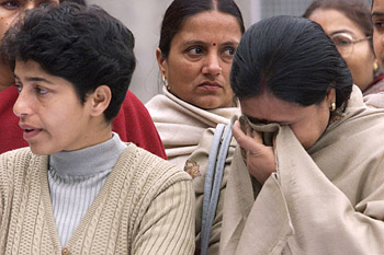 Teachers of Tagore School mourn Kalpana's death during a prayer meeting in Karnal, Haryana, on Sunday.