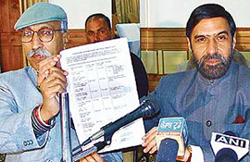 Senior Congress leaders Anand Sharma and Upinder Sharma release a list of properties owned by Himachal Chief Minister Prem Kumar Dhumals family 