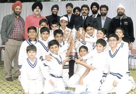 The Gyan Bharti Cricket Academy team with the Chetan Sharma Cricket Trophy