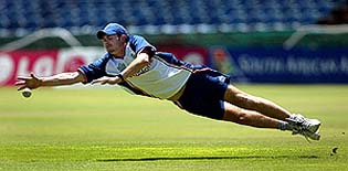 England's James Anderson dives for a catch during a practice session at the St Georges cricket ground in Port Elizabeth 