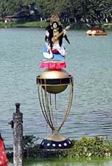 Goddess Saraswati being put on top of a Cricket World Cup replica