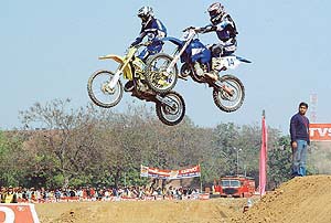 Two riders in action during the 18th Chandigarh Motocross at Circus Grounds, Sector 17, in Chandigarh on Sunday.