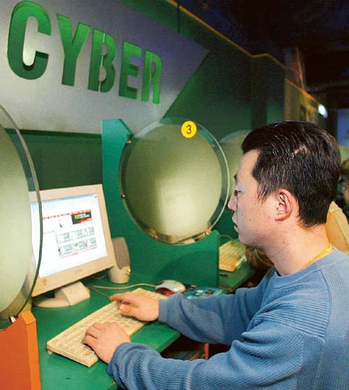 A South Korean man surfs the Web at an Internet cafe in Seoul.