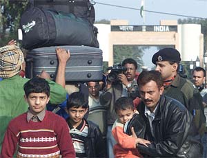 Mohammad Nazi, a staff member of the Pakistan High Commission in New Delhi, arrives with his children