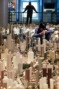A Chinese worker adds new building models
