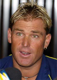 Australian spin bowler Shane Warne speaks during a media conference 