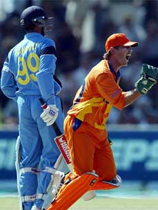 Dutch wicketkeeper Jeroen Smits celebrates after taking a catch to dismiss India's captain Saurav Ganguly 