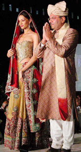 Nassocom chairman Arun Kumar with model on ramp during CEO fashion show 
