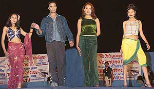 Models display designer wear at a fashion show organised at the Country Club