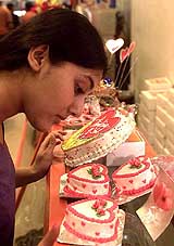 A woman looks at a special Valentine's Day cake