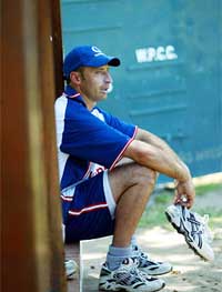 England Captain Nasser Hussain rests after a net session 