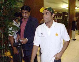 Pakistan's Rashid Latif leaves a news conference after a disciplinary hearing