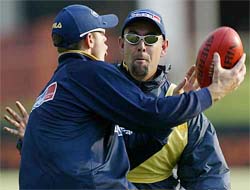 Australian team members Darren Lehmann and Andrew Symonds play touch football 