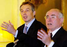 Britain's Prime Minister Tony Blair with his Australian counterpart John Howard 