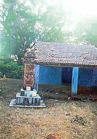 A tribal symbol carved on an ancient pillar outside the temple in the Tirpad devrai