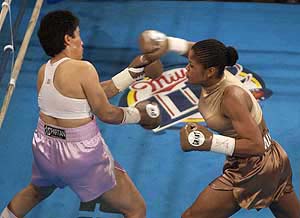 IBA super middleweight champion Laila Ali throws a right at Mary Ann Almager