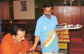 Waiters at Sagar Ratna dressed in colours of Indian cricket team