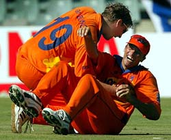 Hollands Roland Lefebvre celebrates after taking the catch of Englands Andrew Flintoff 