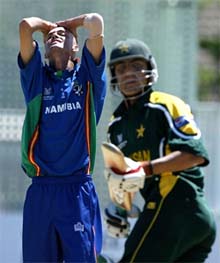 Namibian bowler Bjorn Kotze reacts after Pakistan's Younis Khan hits a boundary 