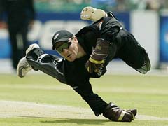 New Zealand's wicket keeper Brendon McCullum dives to stop a ball 
