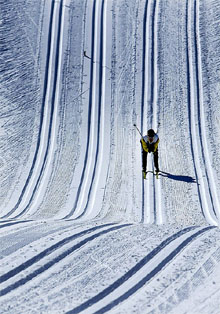 A cross country skier tests the course during a practice session
