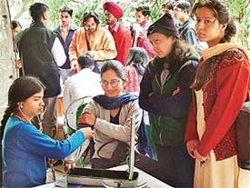 A doctor of Shri Dhanwantry Ayurvedic College and Hospital examines a student at a free medical check-up camp organised by the Akhil Bharatiya Vidyarthi Parishad at Students Centre